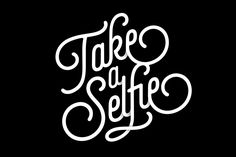 the words take a selfie written in cursive type on a black background