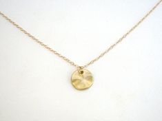 "A lovely small matte silver disc hangs from a beautiful, delicate yet sturdy link chain. A great everyday necklace, dressed up or down. *Available in Gold and Silver. Choose from the drop down menu to the right. GOLD - Disc - Matte 14k Gold plated brass - 11mm in diameter - Chain + components - 14k Gold Fill - Clasp - 14k Gold Fill lobster clasp SILVER - Disc - Matte Rhodium (white gold) plated brass - 11mm in diameter - Chain + components - .925 Sterling Silver - Clasp - .925 Sterling Silver l Delicate Gold Charm Necklaces With Simple Design, Delicate Gold Charm Necklace With Simple Design, Simple Gold Charm Necklaces, Simple Gold Charm Necklace, Gold Charm Necklaces With Round Pendant, Minimalist Brass Charm Necklaces With Coin Pendant, Minimalist Brass Charm Necklace With Coin Pendant, Gold Charm Necklace With Round Pendant, Simple Gold Charm Necklaces For Everyday