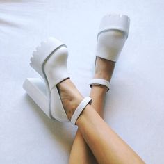 White White Chunky Platform Heels With Round Toe, White Heels With Chunky Platform And Round Toe, White Chunky Platform Heels With Ankle Strap, White Platform Closed Toe Heels, White Platform Heels With Pointed Toe, White Leather Heels With Contrasting Heel Counter, Trendy White Almond Toe Heels, White Pointed Toe Platform Heels, Modern White Platform Heels