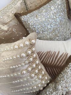 decorative pillows with sequins and pearls on them