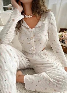 Discover the perfect blend of comfort and style with this elegant pajama set. Crafted from white knitted fabric adorned with a delicate floral pattern, this set combines luxury and relaxation for a restful night's sleep. Here's why you'll love this pajama set: Floral-Patterned White Knitted Fabric: The soft, knitted fabric features a charming floral pattern that adds a touch of elegance to your sleepwear while ensuring comfort. Cropped Top Design: The top of the set boasts a stylish cropped desi Coquette Pajama Set, Pijamas Women Cute, Coquette Pj Set, Cute Pajamas Winter, Womens Pajama Set, Girly Pajama Set, Cottage Core Pajamas, Women’s Pjs, Cute Pajamas For Women Aesthetic