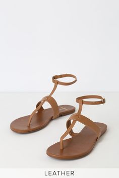 Add a pop of cute to your outfit with the Lulus Colleen Cognac Vachetta Leather Flat Sandals! Sleek vachetta leather forms these cute sandals with a T-strap upper and matching, adjustable ankle strap with gold buckle. 0. 25" rubber heel. Lightly cushioned insole. Rubber sole has nonskid markings. Genuine leather upper. Balance man made materials. Imported. Lulus | Colleen Cognac Vachetta Leather Flat Sandal Heels | Size 8. Spring Toe Post Sandals With Strap, Toe Post Strap Sandals For Spring, Trendy Leather T-strap Sandals For Spring, Trendy Brown T-strap Sandals For Spring, Brown Toe Post Sandals For Spring, Chic Brown T-strap Sandals With Removable Insole, Brown Toe Post T-strap Sandals For Spring, Trendy Ankle Strap Sandals, Trendy Adjustable Ankle Strap Sandals