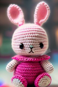 a crocheted bunny doll sitting on top of a table