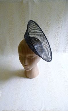 "One hat base with a 3.75\" tall upturned brim made in black stiffened sinamay straw that measures approximately 11\" (27.94 cm) in diameter at the top. The base is contoured to fit against the head. The edges of the brim are finished in sinamay. The multi-layer stiffened sinamay straw has a very delicate look but it has a great sturdy weave and provides excellent support for your millinery creations. This is NOT a finished hat and will not stay on your head unless you add a head band to wear. A Fascinator Hats Diy, Edwardian Hat, Blank Hats, Sinamay Hats, Millinery Supplies, Hat Base, Metal Headbands, Millinery Hats, Diy Hat