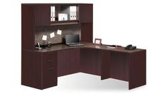 an office desk with a laptop on it