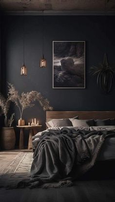 a bedroom with dark walls and wooden floors, an art work on the wall above the bed