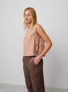 "AVERY is a linen tank top with side ties. DETAILS - Sleeveless design - Crew Neck - Side Ties - Straight cut - 100% lightweight European linen fabric - Cut and sewn to order just for you in our studio COLOR - Camel, you can also choose other colors above - Fabric samples are available here https://www.etsy.com/listing/586569696/linen-fabric-samples SIZING & FIT - Fits true to size - Length is approximately 19 inches / 48 cm - Bust is approximately 19 inches / 48 cm - Measurements taken from a size S - Model is 5'8\" / 173cm and wearing a size S CARE FOR LINEN - Machine wash up to 30ºC/86ºF gentle cycle - Lay flat to dry or tumble dry low - Warm iron if needed - Do not bleach SIZE GUIDE Size conversion guide Size XS (US 0-2, IT 36-38, UK 4-6, Japan 3-5, France 32-34) Size S (US 4-6, IT 40- Side Tie Tank Top, Linen Sleeveless Top, Tie Tank Top, Gents Kurta Design, Gents Kurta, Linen Tunic Tops, Kurta Design, Studio Color, Linen Tank Top