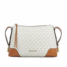 Get the luxe look when you carry the MICHAEL Michael Kors Crosby Medium Messenger bag. leather  Zipper closure. Adjustable crossbody strap. Signature logo hardware detail at front. Flat bottom. Lined interior. Interior zip and slip pockets. Bottom Width: 11 3⁄4 in Depth: 3 3⁄4 in Height: 7 1⁄2 in Strap Length: 42 in Strap Drop: 18 1⁄2 in Weight: 1 lb 0.2 oz Messenger Bag Leather, Woman Bags Handbags, Purses Michael Kors, Leather Zipper, Louis Vuitton Bag Neverfull, Signature Logo, Michael Kors Monogram, Carousel, Logo Print