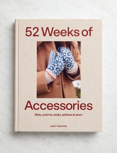 the cover of 52 weeks of accessories by laurie purches, with an image of a woman's hand in blue and white mittens