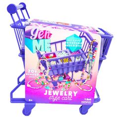 a toy shopping cart with jewelry on it