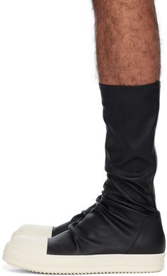 High-top stretch grained lambskin slip-on sneakers in black. · Buffed calfskin cap toe · Sock-style collar · Padded calfskin footbed · Treaded thermoplastic rubber sole Supplier color: Black/Milk/Milk Rick Owens Boots, Milk Brands, Sock Style, Black Shoes Men, Sock Sneakers, Lipstick Bag, Chain Strap Bag, Toe Socks, Floral Shoes