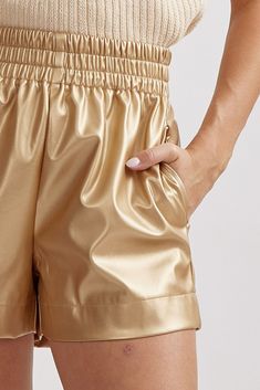 Faux leather High waisted shorts Elastic waistband Side pockets Unlined Woven Non-sheer Lightweight The Faux Leather High leather-waisted shorts in Gold are a stylish and edgy addition to your wardrobe. These shorts effortlessly combine fashion and comfort, making them a standout choice for creating trendy outfits. Leather High Waisted Shorts, Faux Leather Shorts, Gold Shorts, Leather Shorts, Gold Leather, High Waisted Shorts, Lightweight Fabric, Trendy Outfits, Faux Leather