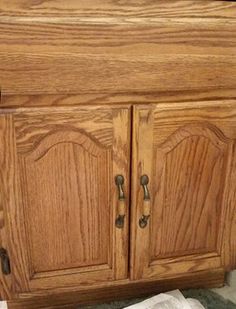 a close up of a wooden cabinet on the ground