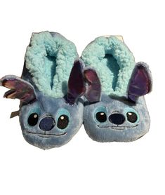 a pair of slippers that have been made to look like koalas with ears