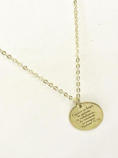 PLEASE NOTE THAT DUE TO SIGNIFICANT POSTAL DELAYS CURRENTLY BEING EXPERIENCED, ORDERS PLACED AFTER DECEMBER 9TH MAY NOT ARRIVE IN TIME FOR CHRISTMAS.  This is a gold plated necklace with a gold plated stainless steel laser engraved pendant with "Rejoice in hope, be patient in tribulation, be constant in prayer" from Romans 12:12 on it.  This pendant is available on your choice of 16, 18, 20, 22, 24, 26, 28 or 30 inch chain. This jewelry item has small parts and is not intended for anyone under t Meaningful Gold Nickel-free Charm Necklace, Gold Inspirational Hand Stamped Charm Necklace, Inspirational Gold Hand Stamped Charm Necklace, Spiritual Gold Hand Stamped Jewelry, Gold Hand Stamped Spiritual Jewelry, Gold Spiritual Hand Stamped Jewelry, Spiritual Laser Engraved Gold Jewelry, Spiritual Gold Laser Engraved Jewelry, Laser Engraved Spiritual Gold Jewelry