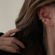 Everyday delicate ear jewelry set, enjoy the fun of mix and match. Dainty gold lace layering cuff earrings and cuff threader. Exquisite sparkly cz embedded layering with gold cuff, matches perfectly with dangling cuff threader. The threader is very versatile, can be wear in 2 ways, both stunning as either pierced or non pierced earrings. Go as you please, be you, be stylish everyday. 💎 Features: ♥ Finish Tone: 14K gold plated ♥ Side Stone: Cz crystal ♥ Ear cuff + Cuff threader Set ♥ Non-pierced Trendy Ear Climbers As A Gift, Dainty Single Ear Climber For Parties, Dainty Single Ear Cuff For Party, Dainty Ear Climbers For Parties, Dainty Ear Climbers For Party, Dainty Dangle Ear Cuff, Dainty Dangle Ear Cuff For Pierced Ears, Dainty Dangle Single Ear Cuff, Dainty Dangle Pierced Ear Cuff