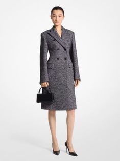 Softly structured and meticulously tailored in Italy, this herringbone tweed coat features lightly padded shoulders, a double-breasted closure and a carved-out waistline for feminine definition. An ideal outer layer for work and evening alike, it looks smart teamed with a timeless top-handle bag and pointed-toe pumps, as seen on our Fall/Winter 2024 runway. Luxury Fall Tweed Dress For Office, Luxury Tweed Dress For Fall Office Wear, Luxury Tweed Dress For Office In Fall, Luxury Tweed Wool Coat For Work, Luxury Tweed Dress For Workwear In Fall, Fitted Tweed Wool Coat For Work, Elegant Tweed Wool Coat For Work, Elegant Fitted Tweed Wool Coat, Luxury Winter Tweed Dress For Formal Occasions