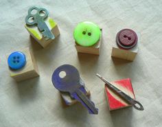 several different types of buttons and scissors on a table