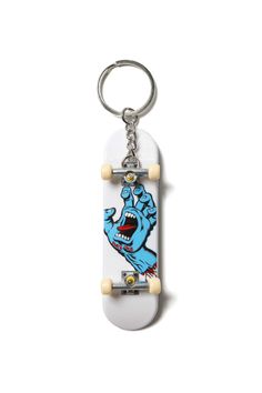 a skateboard keychain with an image of a cartoon character on the front