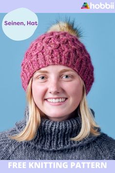 a woman wearing a pink knitted hat with a pom - pom