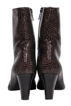 Step out in a fun sleek boot by Aquatalia! Made with a sleek reptile embossed design and trendy calf-high style. Style with distressed jeans and a chunky sweater for a day trip to the city or wear with your favorite slip dress and leather jacket for a night out! Size 9.5 Made in Italy Patent leather upper w/ crocodile embossed design Side zipper closure on both sides Calf high shaft Leather sole and footbed w/ very minor wear Shaft 5" Heel 3” Fitted Crocodile Pattern Boots For Fall, Chic Crocodile Pattern Boots For Fall, Winter Leather Boots With Crocodile Pattern, Trendy Leather Boots With Crocodile Pattern, Fall Snake Print Ankle Boots, Fitted Leather Boots With Snake Print, Fitted Leather Snake Print Boots, Leather Heeled Boots With Snake Print For Fall, Fall Leather Heeled Boots With Snake Print