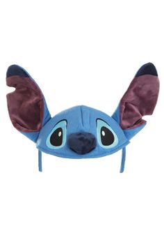 a stuffed animal head with ears and eyes