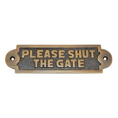 a metal sign that says please shut the gate on it's front end,