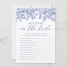 an all eyes on the bride game card with blue flowers and greenery is shown