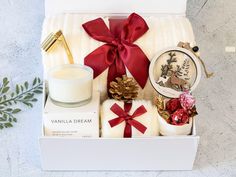 a white box filled with candles and other items