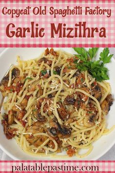 a white plate topped with pasta covered in sauce and mushrooms on top of a pink checkered table cloth