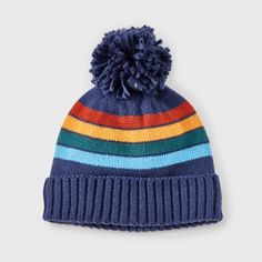 a blue hat with multicolored stripes and a pom - pom on top