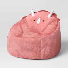 a pink bean bag chair with horns on it