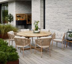 a wooden table sitting on top of a wooden deck