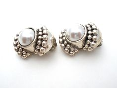 Vintage Jewelry - This is a pair of sterling silver clip on earrings with a bead design and gray white faux pearl. The earrings each hallmarked 925 twice, measure 1" by .63", and weigh 16.6 grams. The pearls are 9mm in diameter. I have a matching ring listed. Matching Rings, Bead Designs, Sterling Earrings, Faux Pearl, Clip On Earrings, Sterling Silver Earrings, Silver Earrings, Vintage Jewelry, Pearl Earrings