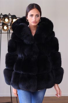 An extravagant statement piece, this oversized faux fur coat with a cozy hood combines warmth and style effortlessly, making a bold fashion statement in chilly weather. Luxuriously soft faux fur drapes elegantly, offering both comfort and a touch of glamour to any winter ensemble. Faux Fox Fur Coat, Oversized Faux Fur Coat, Black Fur Coat, Faux Coat, Black Winter Jacket, Fox Fur Vest, Faux Fur Hooded Coat, Fox Fur Jacket, Casual Outwear