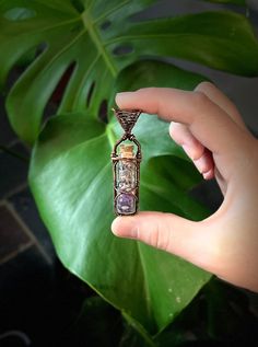 "Pendant is roughly 2.5\" tall and .5\" wide. Glass jar with amethyst chips and lavender. Made of antiqued and polished copper wire. Comes on black waxed cord with clasp." Jar Necklace, Spell Jar, Wire Wrap Pendant, Harrisburg Pa, Wire Work, Wrapped Pendant, Wire Wrapped Pendant, Jewelry Diy, Glass Jar