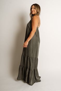 COLOR: Ash Grey Wash FIT: Runs true to size. MODEL: Breanna is 5’ 1” / wearing a small. MATERIAL: 100% Tencel GARMENT DETAILS: Maxi-length, adjustable spaghetti straps, elastic back, and tiered composition. CARE: Hand wash cold mild detergent, do not bleach, lay flat to dry, light steam if needed or dry clean. MEASUREMENTS: FLAT LAY & ARE APPROXIMATE SIZE LENGTH BUST WAIST SMALL 54” 40” 22” MEDIUM 55” 42” 23” LARGE 56” 44” 24” Cotton Slip Dress With Adjustable Spaghetti Straps, Casual Maxi Sundress With Adjustable Straps, Casual Fitted Maxi Dress With Adjustable Straps, Casual Maxi Length Sundress With Adjustable Straps, Cotton Maxi Dress With Spaghetti Straps For Brunch, Casual Maxi Dress With Elastic Back, Spring Maxi Dress With Strappy Elastic Back, Casual Maxi Dress With Straps For Brunch, Casual Maxi Dress With Spaghetti Straps And Tie Back