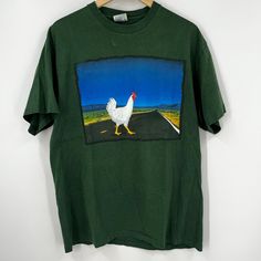 Add Some Vintage Flair To Your Wardrobe With This Double-Sided Budweiser Chicken T-Shirt. Made From High-Quality Fabric, This Shirt Features A Fun And Quirky Design That Is Perfect For Any Casual Occasion. The Green Color And Short Sleeves Make It A Great Choice For Warm Weather, While The Regular Fit And Size Xl Ensure That It Will Fit Most Men Comfortably. With Its Double-Sided Design And Single Stitch Construction, This Shirt Is A Must-Have For Any Beer Lover Or Vintage Enthusiast. Whether You're Heading Out To A Bbq Or Just Hanging Out With Friends, This Shirt Is Sure To Get You Noticed. So Don't Wait Any Longer, Add This Unique Budweiser Chicken T-Shirt To Your Collection Today! Green 90s Style T-shirt For Summer, 90s Style Green T-shirt For Spring, Green Relaxed Fit 90s Top, 90s Green Short Sleeve Tops, Stitch Tshirt, Vintage Budweiser Shirt, Novelty Short Sleeve T-shirt With Cartoon Print, Quirky Design, Double Sided