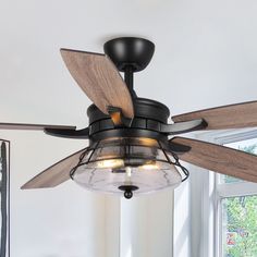 a ceiling fan with two light bulbs on it