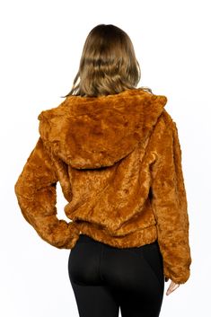 Step into the colder seasons with our Hooded Faux Fur Jacket, an item from the Sadira Collection that perfectly encapsulates the blend of comfort and style. This jacket is also a tasteful addition to the Scarlet Peaks ensemble, allowing you to embrace the captivating allure of autumn's beauty and the magic of the great outdoors. Made from 100% polyester, this hooded fur jacket offers a relaxed fit that ensures maximum comfort without compromising on style. The zip-front closure and side pockets add practicality, making it your go-to outerwear for the chilly weather. And let's not forget about the care instructions - this jacket is dry clean only, ensuring it maintains its plush texture and rich color for many seasons to come. The Sadira Collection is all about wearing clothes that make you Hooded Fur Coat With Faux Fur Lining For Fall, Hooded Faux Fur Coat For Fall, Cozy Hooded Faux Fur Outerwear, Fall Hooded Jacket With Faux Fur Trim, Long-sleeved Double-lined Hood Fur Coat For Fall, Hooded Faux Fur Outerwear For Fall, Brown Hooded Faux Fur Outerwear, Trendy Hooded Fur Coat For Cold Weather, Brown Outerwear With Adjustable Hood For Fall