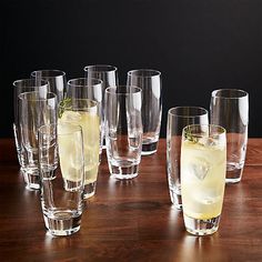 many glasses are lined up on a table