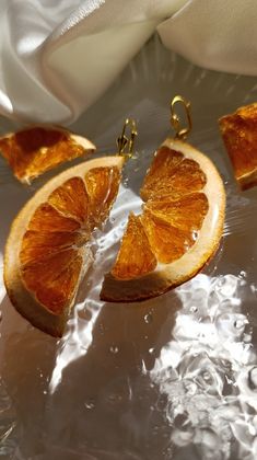 The warmth of the sun and the freshness of nature come to life in these unique handmade earrings!  Bringing the refreshing breezes of the Mediterranean to your ears, these earrings are crafted by carefully drying real orange slices and preserving them in epoxy.  Each orange slice transforms into a piece of art with its vibrant orange tones and textures. Details: - Materials: Natural dried orange slices, crystal-clear epoxy resin, gold-plated hooks. - Size: Each earring is approximately 5 cm long Crystal Clear Epoxy Resin, Fruit Orange, Birthday Summer, Unique Handmade Earrings, Orange Slice, Dried Orange Slices, Clear Epoxy Resin, Fruit Earrings, Orange Tones