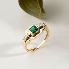 Elegant 14k Gold Emerald Cut Birthstone Ring, Elegant 14k Gold Birthstone Ring With Emerald Cut, Elegant Formal Ring With May Birthstone, Luxury Formal Rings For May Birthstone, Elegant Formal May Birthstone Ring, Elegant 14k Stamped Cluster Ring For Promise, Elegant 14k Gold Emerald Ring With Center Stone, Timeless Emerald Signet Ring For Anniversary, Classic Brilliant Cut May Birthstone Ring