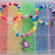 I have been collecting and making kandi since my early rave days in 2000. I will be making special kandi sets that include vintage beads from my collection. Have a little piece of kandi history. I created a playlist on my YouTube channel Kandi Toybox (My kandi bead collection) if you would like to see my collection! These kandi bracelets are made with mostly vintage beads from the 90s,early 2000s and some new beads. New beads are some of the pony beads. Includes 3 bracelets. Bracelet size 7-8 inches  This set is premade and is ready to ship! Perfect for any event! You will get lots of compliments in this unique wearable art! Stand out at your next event! Birthday party  Edm festival  Raves Rave outfit  Festival outfit Pride Stocking stuffer  Party favor  Glow party Rave birthday  Rave anni Rainbow Beaded Bracelets For Rave, Rave Style Plastic Beaded Bracelets, Multicolor Plastic Beaded Bracelets For Rave, Multicolor Plastic Bracelets For Rave, Multicolor Plastic Rave Bracelets, Multicolor Plastic Rave Jewelry, Rave Style Multicolor Plastic Bracelets, Bracelets Kandi, Rave Bracelets