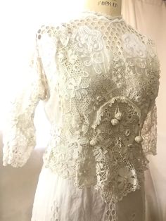 antique Edwardian Irish Crochet lace raised embroidery dress M | eBay Elegant Lace Embroidered Wedding Dress, Elegant Cotton Lace Top, Elegant White Crochet Top With Lace Sleeves, Fitted Crochet Dress With Lace Patchwork For Wedding, Fitted Crochet Lace Dress With Lace Trim, Fitted Lace Crochet Dress With Lace Trim, Lace Dress With Lace Sleeves For Garden Party, Lace Dress With Lace Work For Garden Party, Intricate Embroidery Lace Wedding Dress