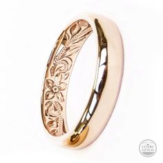 a wedding ring with an intricate design on it