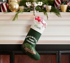 a christmas stocking hanging from a fireplace mantel