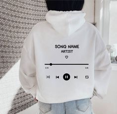 "Custom Playlist Hoodie, Personalized Song Hoodie, Song and Artist Hoodie, Trendy Custom Hoodie, Tumblr Hoodie, VSCO Hoodie, Aesthetic Hoodie ~ Printed in USA ~ ~ Gildan ~ HOW TO ORDER Please review all the pictures for size chart and color options before making a decision. 1) Choose the t-shirt color (see the color chart and message me if the color you want is not available on the drop down) 2) Choose the t-shirt size 3) Choose the design/text color (Black or White) 4) Choose the quantity 5) Cl Hoodie Print Ideas, Custom Hoodies Ideas, Artist Hoodie, Hoodie Design Ideas, Vsco Hoodie, Hoodie Personalized, Hoodie Aesthetic, Trendy Hoodies, Custom Hoodie