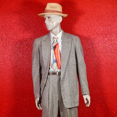 This spectacular and very sharp 1950s Gray Tweed California styled Sport suit by Penney's ticks all the right boxes. Jacket features peaked lapels, one button link closure and patch pockets on both hips and left chest. Tapered high waisted drop loop pants. 1950s Hollywood Sportswear at its very best. Condition - Very Good. Size Jacket 40 Pants 32 Measurements in inches. Jacket Chest 44" Shoulders 18 1/2" Length 32" Sleeves 24" Pants  Waist 32" Inseam 30" Front Rise 13" All items have been cleaned, unless otherwise stated. Please email us with any questions before purchase. We always refund any shipping overages. International buyers, Be aware that there may be a Customs charge on delivery which the buyer is responsible for. Please check your countries' customs policies before purchasing. C Retro Tailored Tweed Blazer, Tailored Retro Tweed Blazer, Vintage Tweed Suit For Formal Occasions, Retro Tweed Blazer With Notch Lapel, Retro Notch Lapel Tweed Jacket For Formal Occasions, Retro Formal Tweed Jacket With Notch Lapel, Retro Tweed Jacket With Notch Lapel For Formal Occasions, Retro Tailored Suit With Notch Lapel, Retro Tailored Single Breasted Tweed Jacket