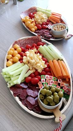 two plates filled with different types of food on top of a table next to each other